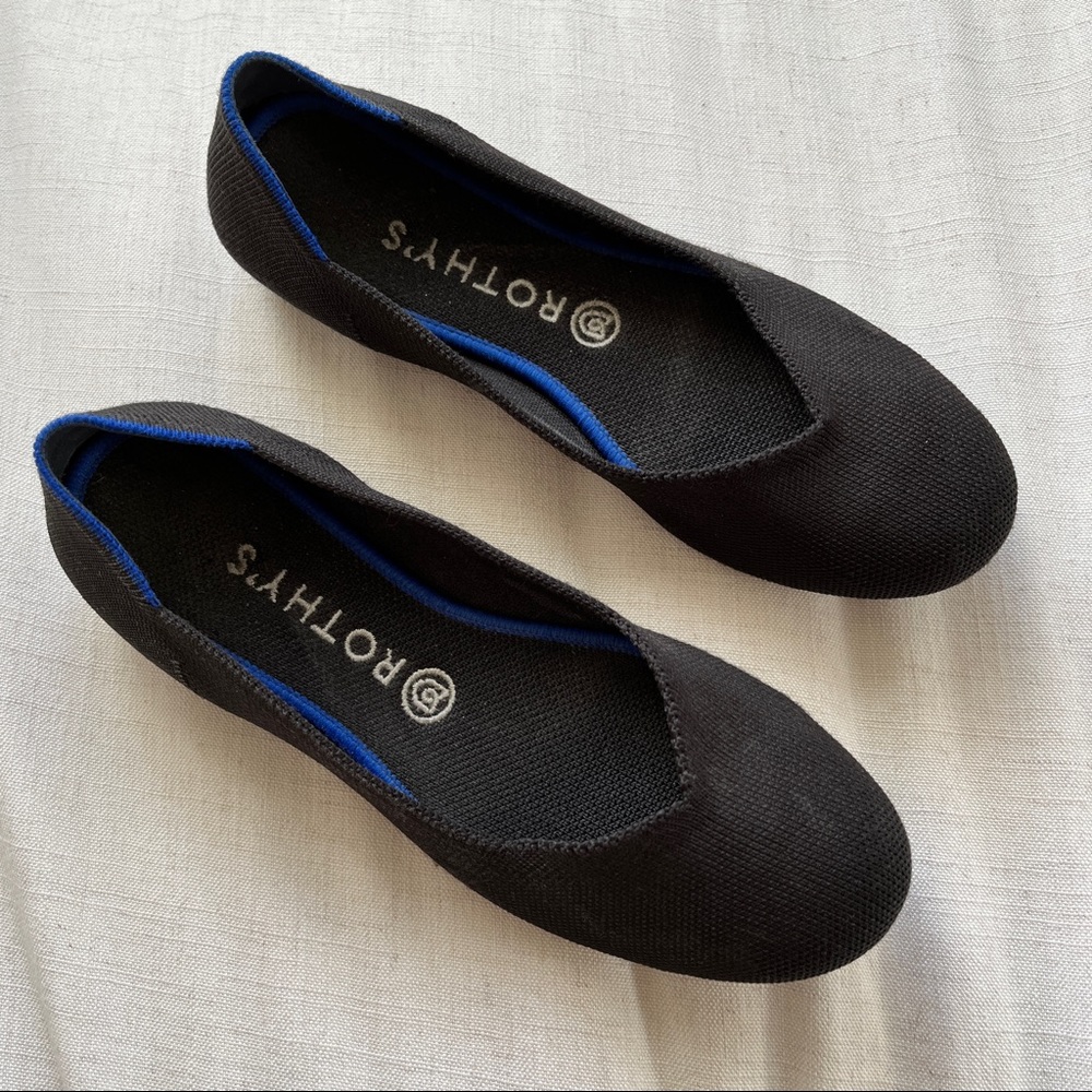 Rothy's Elegant Black Flats with Blue Accent